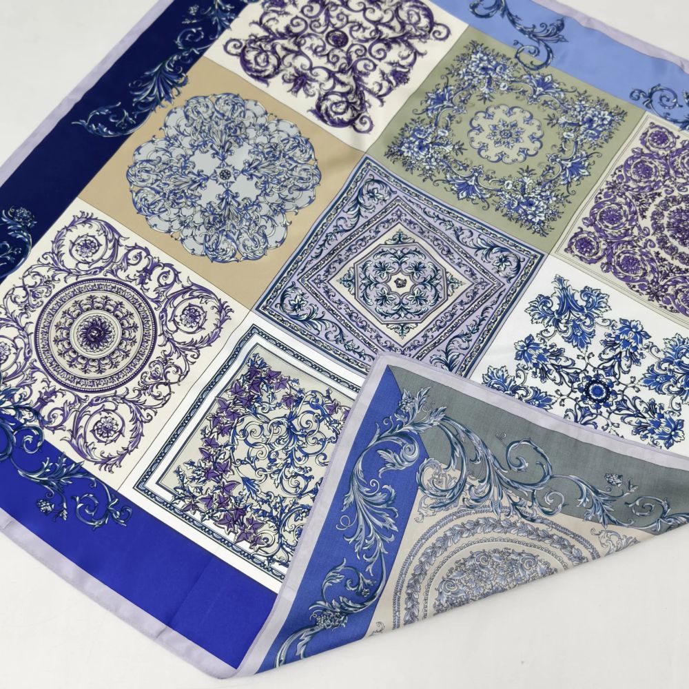 A DOCSUN custom silk square scarf featuring double-sided printing and machine-hemmed edges. One corner is folded over to display the identical, vibrant blue and purple vintage baroque and porcelain tile mosaic patterns on both sides.