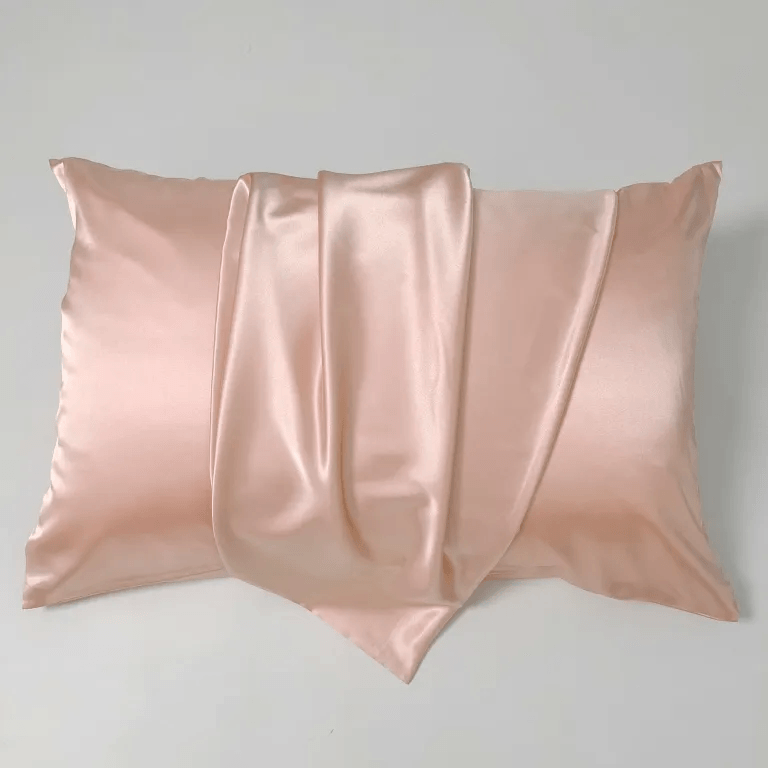 Pink custom silk satin pillowcase showing smooth luster and soft hand feel