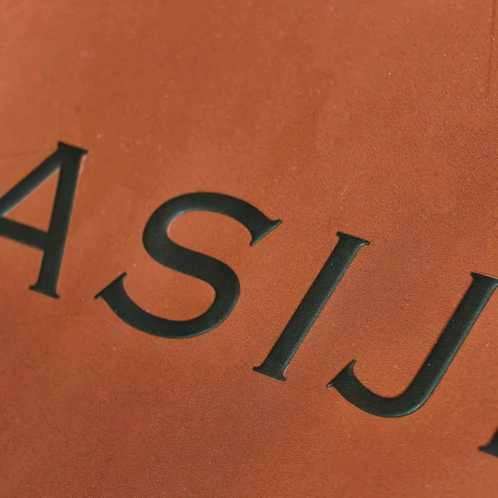 DOCSUN embossing process for raised packaging logo details