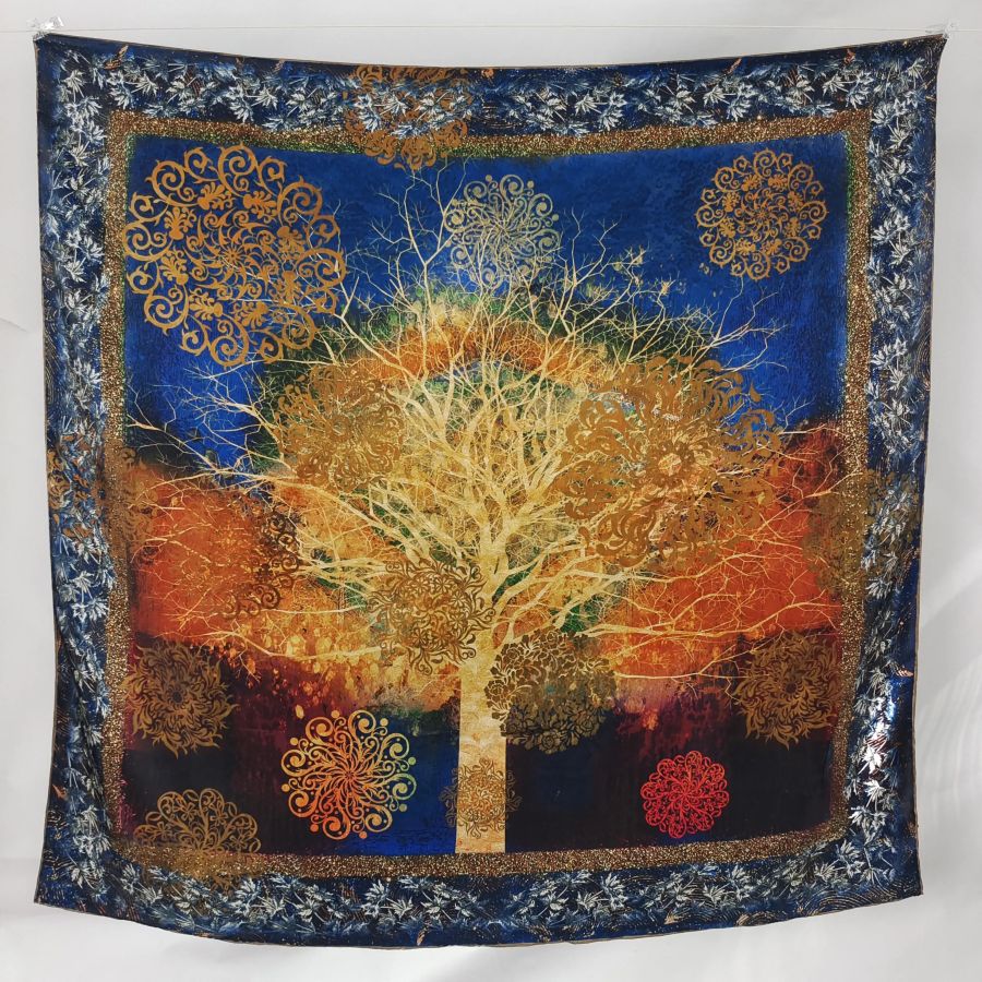 A square 90cm mulberry silk scarf featuring a majestic, glowing golden tree of life design over a rich royal blue and deep orange background, detailed with intricate mandala patterns and a decorative blue floral border.
