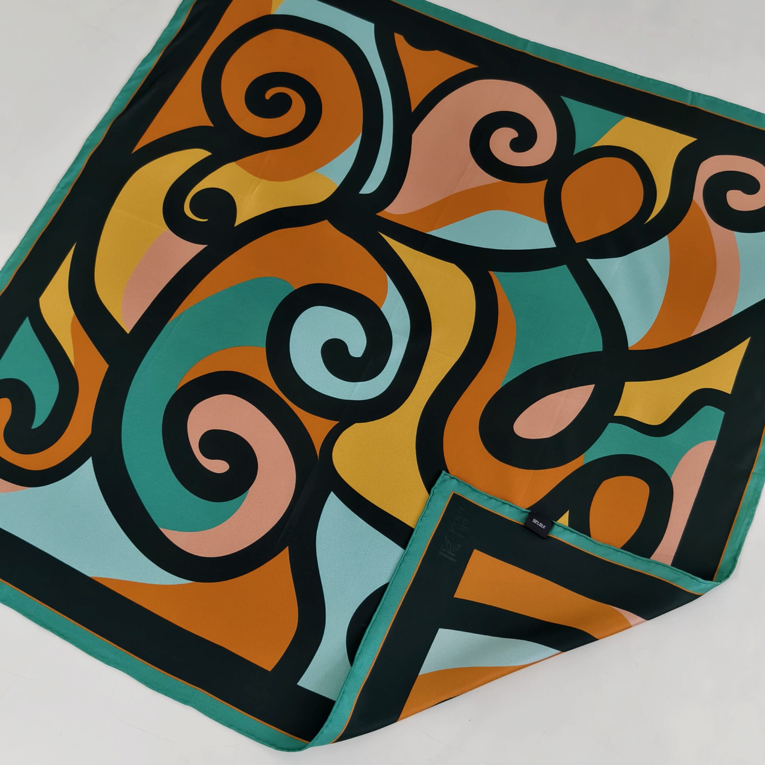 Printed silk scarf for women demonstrating rich color and detailed artwork