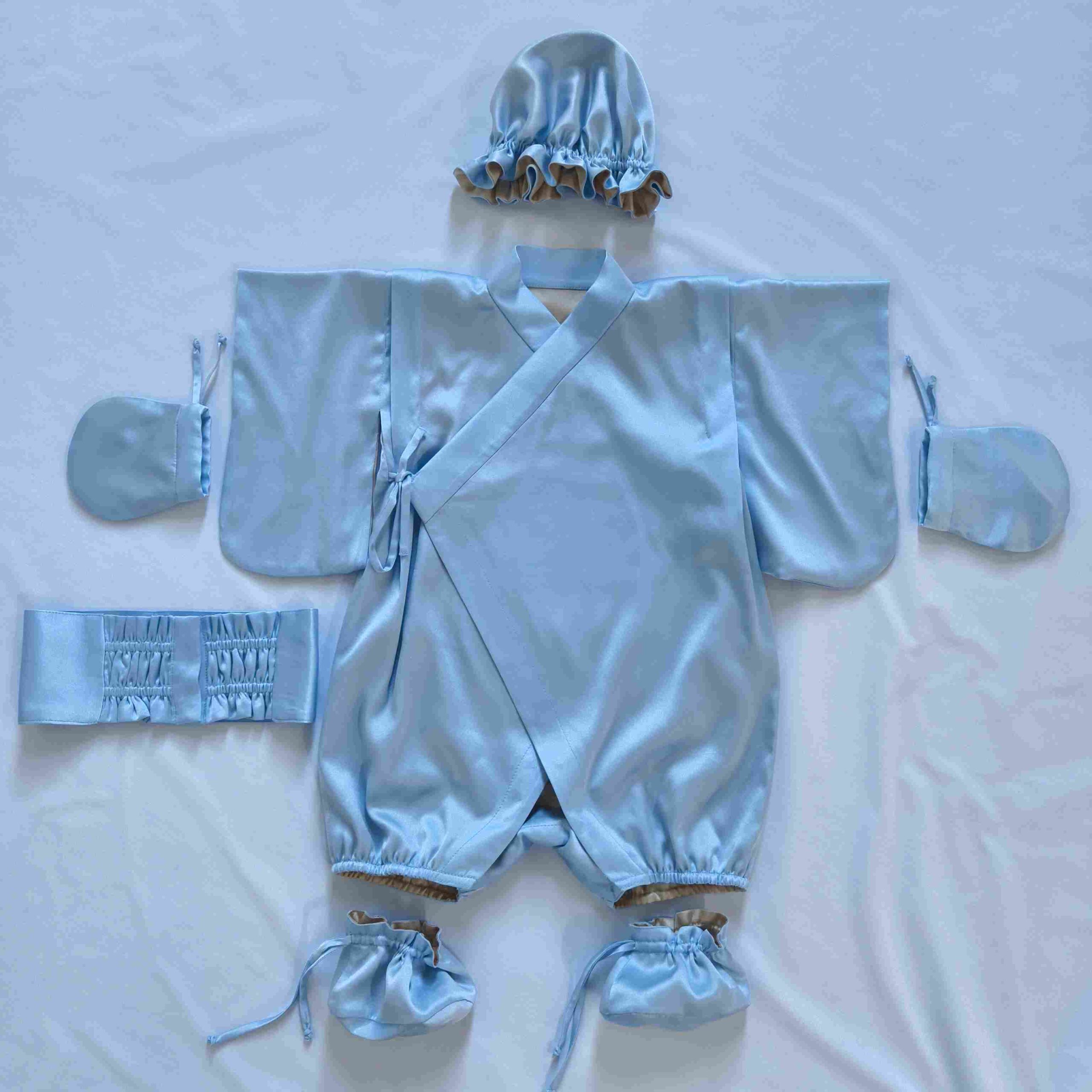 White 100% mulberry silk baby kimono showing soft fabric and reversible garment design