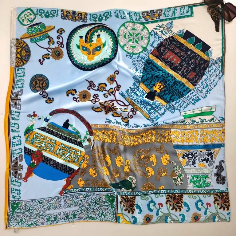 Colorful custom silk scarf showing fabric drape and personalized design for fashion brands