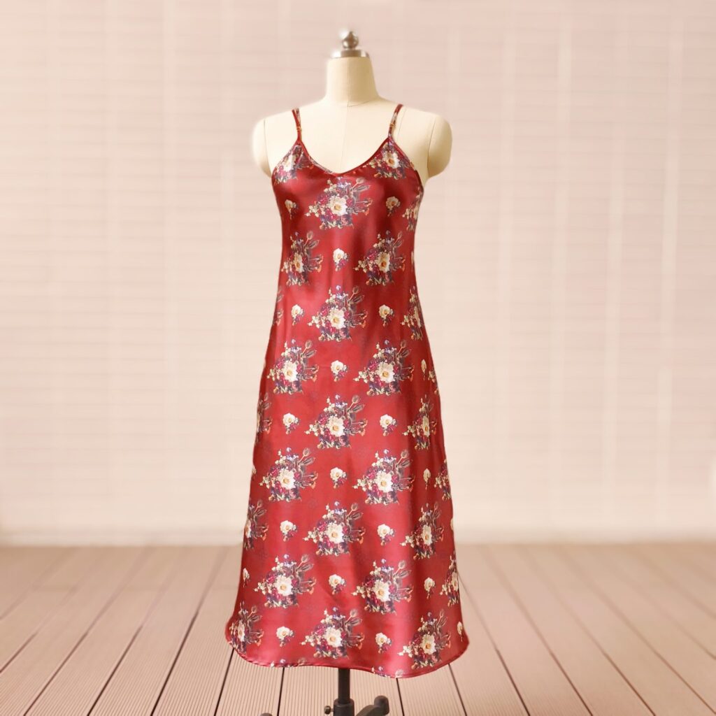 A Custom made mulberry silk slip dress with an elegant V-neckline and adjustable spaghetti