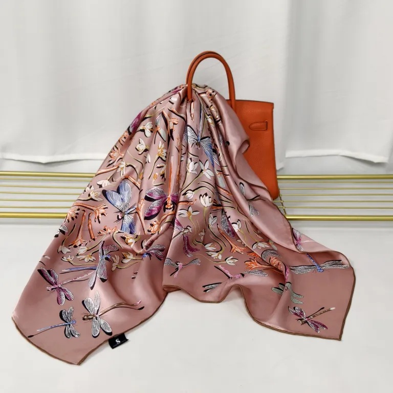Custom silk scarf manufacturer reviewing printed scarf artwork and production quality