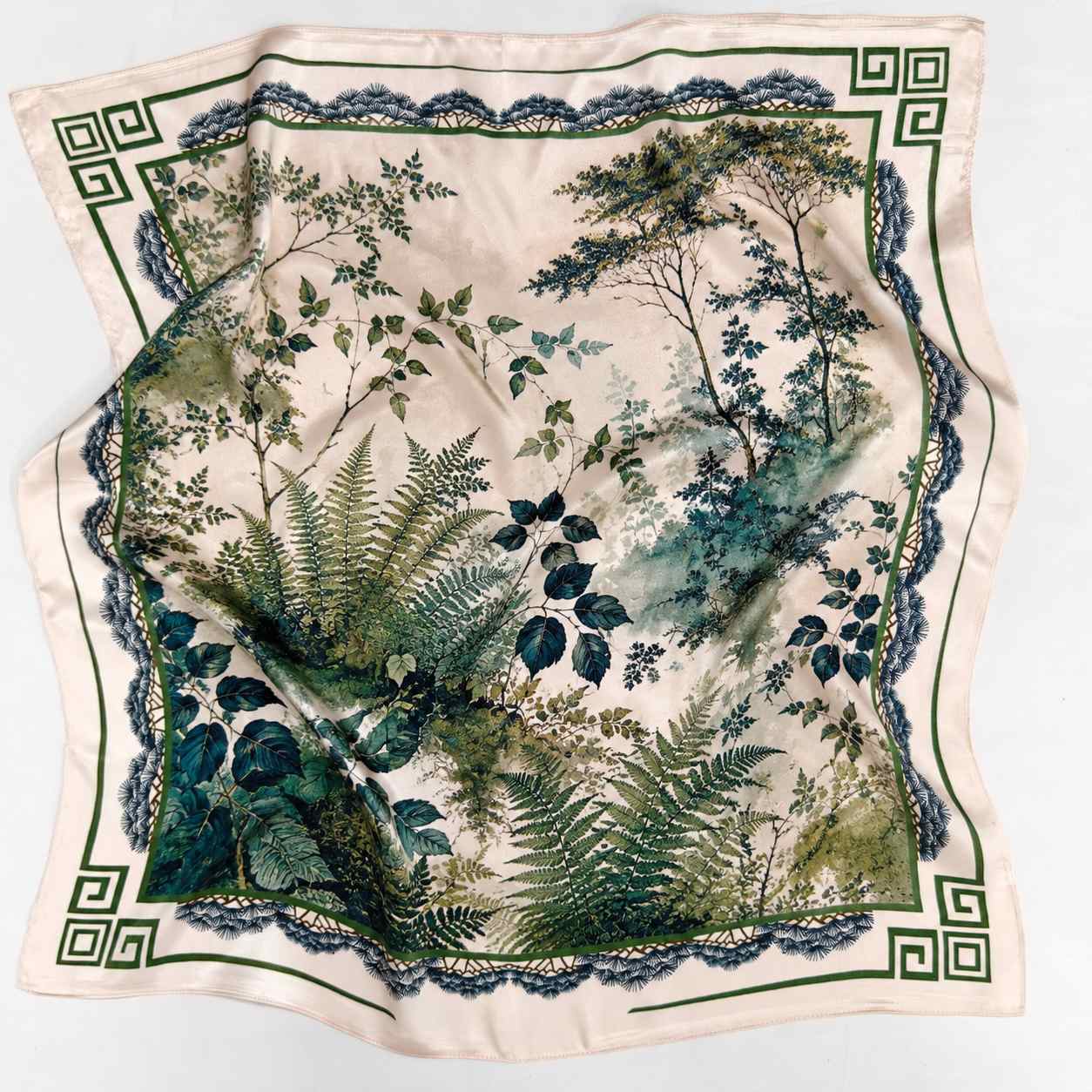 Double-sided silk scarf showing printed artwork and luxury scarf drape