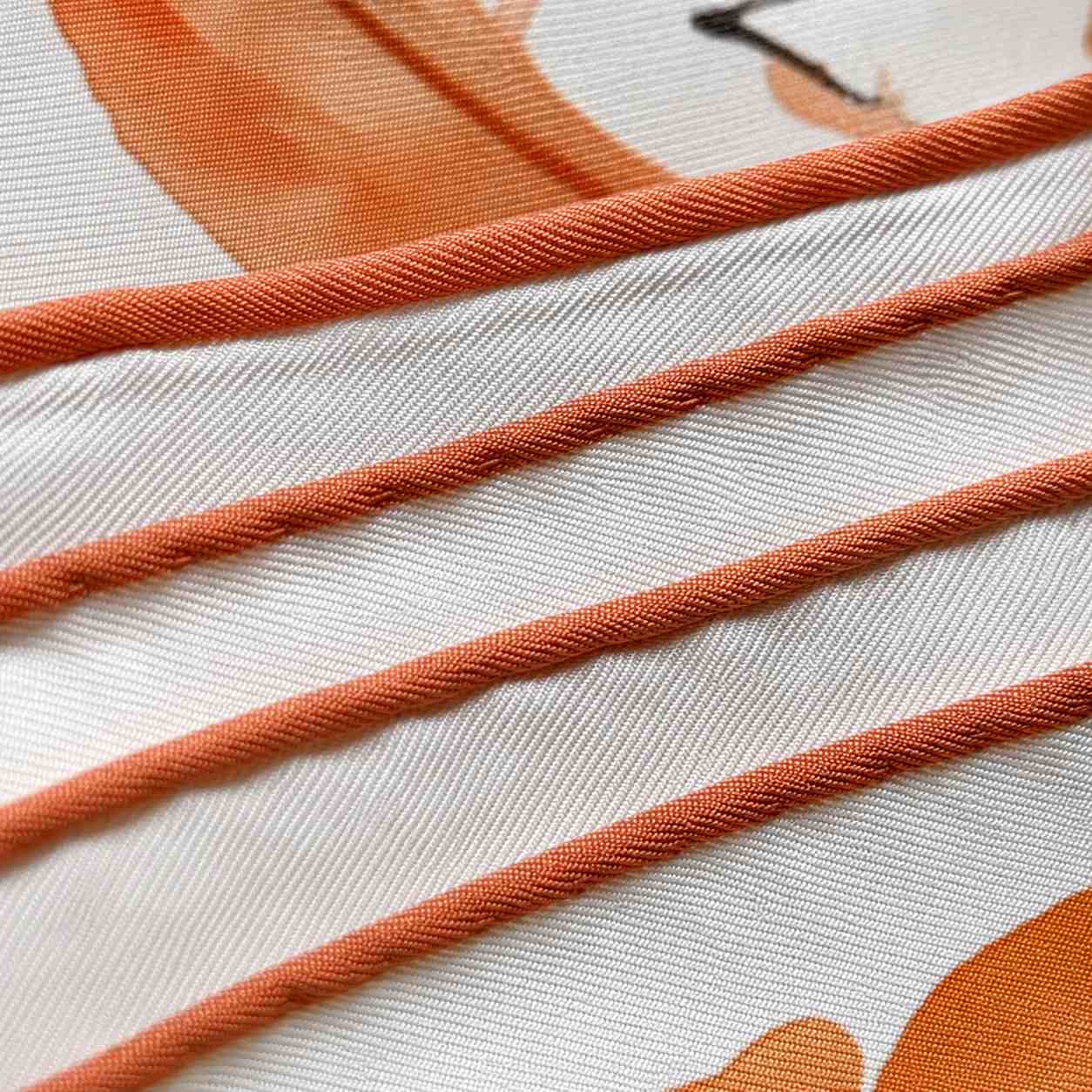 Hand hemming on custom silk scarves for women with premium edge finishing