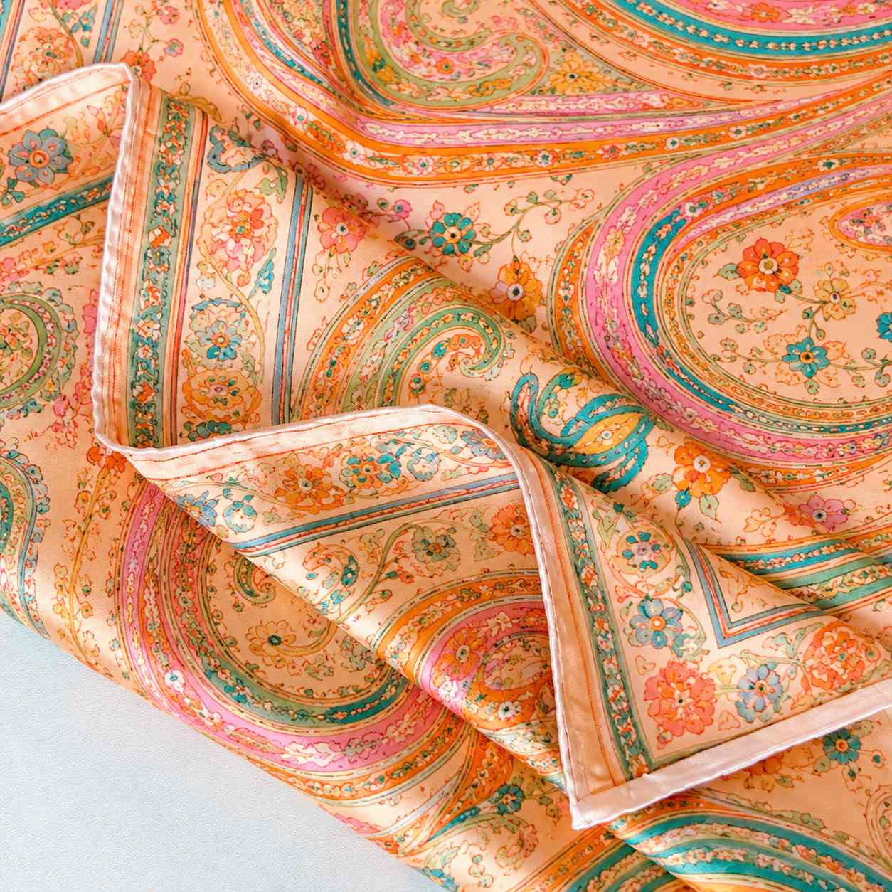 Hand rolled fine silk scarves showing premium edge finishing for custom scarf projects