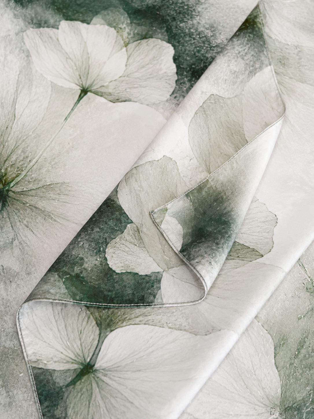 Luxury custom silk scarf detail showing print quality and edge finishing