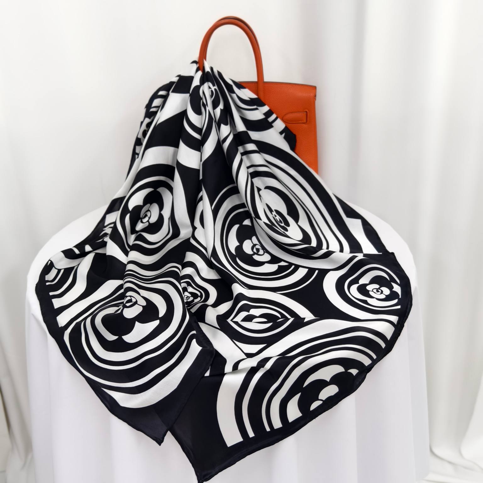 Black flower printed mulberry silk scarf showing premium wholesale scarf fabric and print clarity