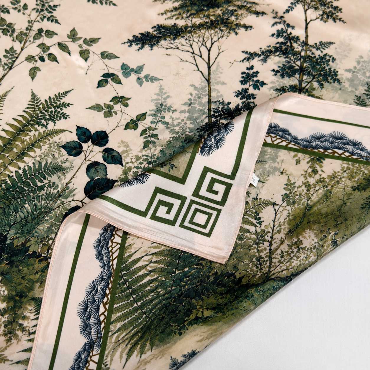 Machine hemming on custom printed silk scarves for scalable production