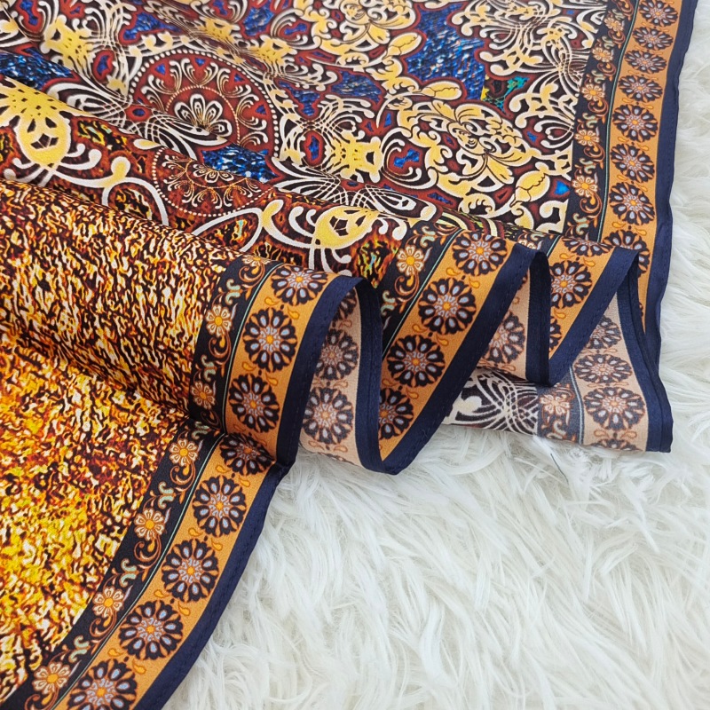Close-up of a consistent machine-finished hem on a silk scarf
