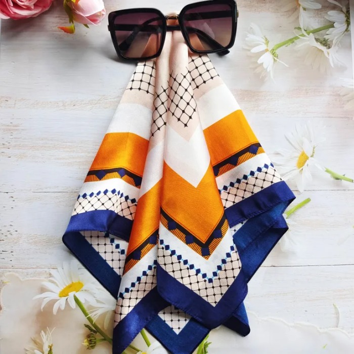 Custom printed mulberry silk scarf prepared for branded presentation