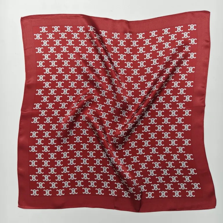 A DOCSUN 90cm mulberry silk square scarf in vibrant red with a white geometric monogram pattern, laid flat against a white background.