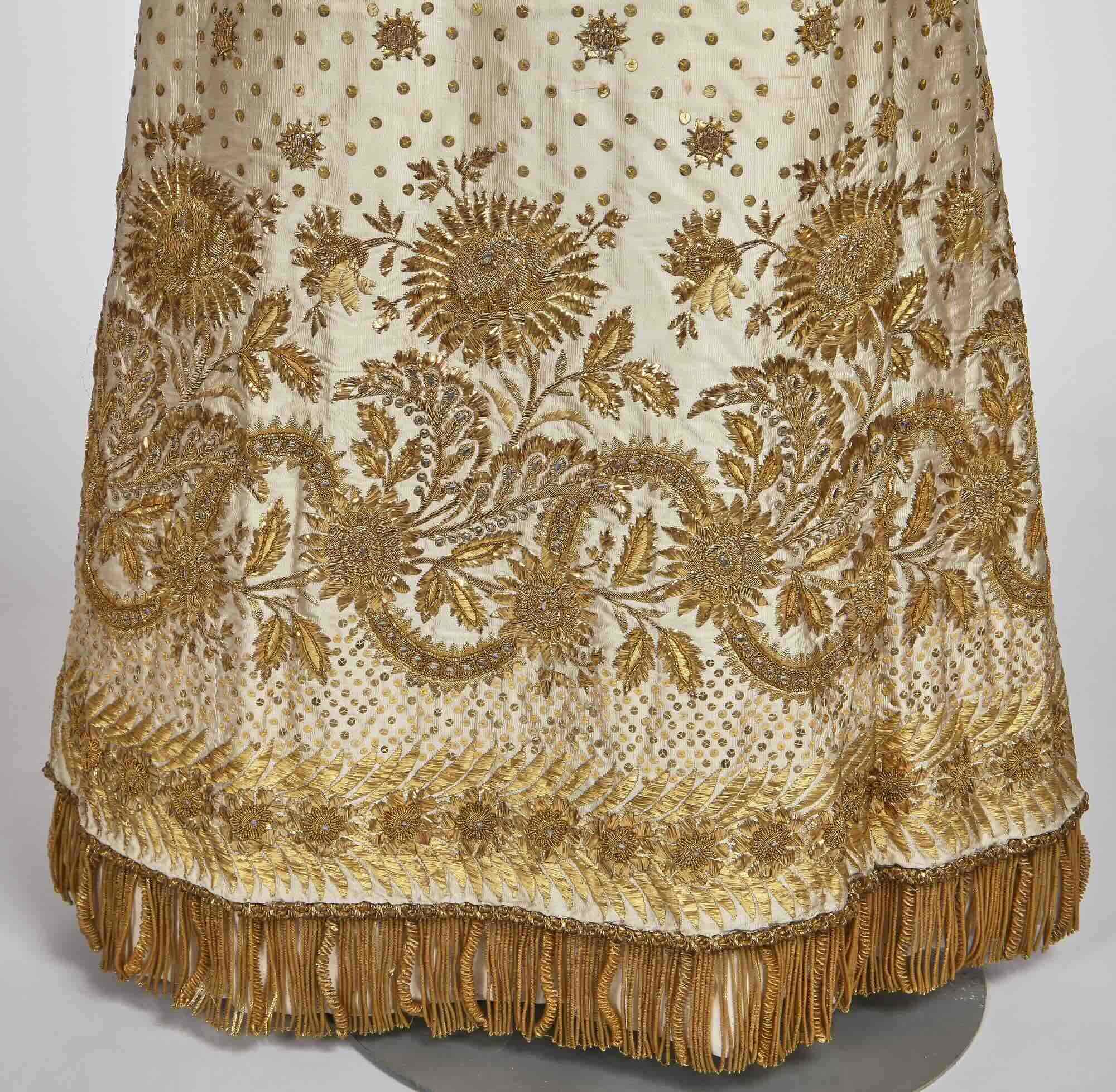 Part of a court dress with ivory silk ground and ornate metallic embroidery