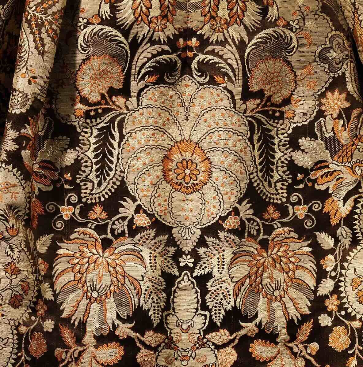 Part of British Spitalfields silk dress from 1725 showing woven floral pattern
