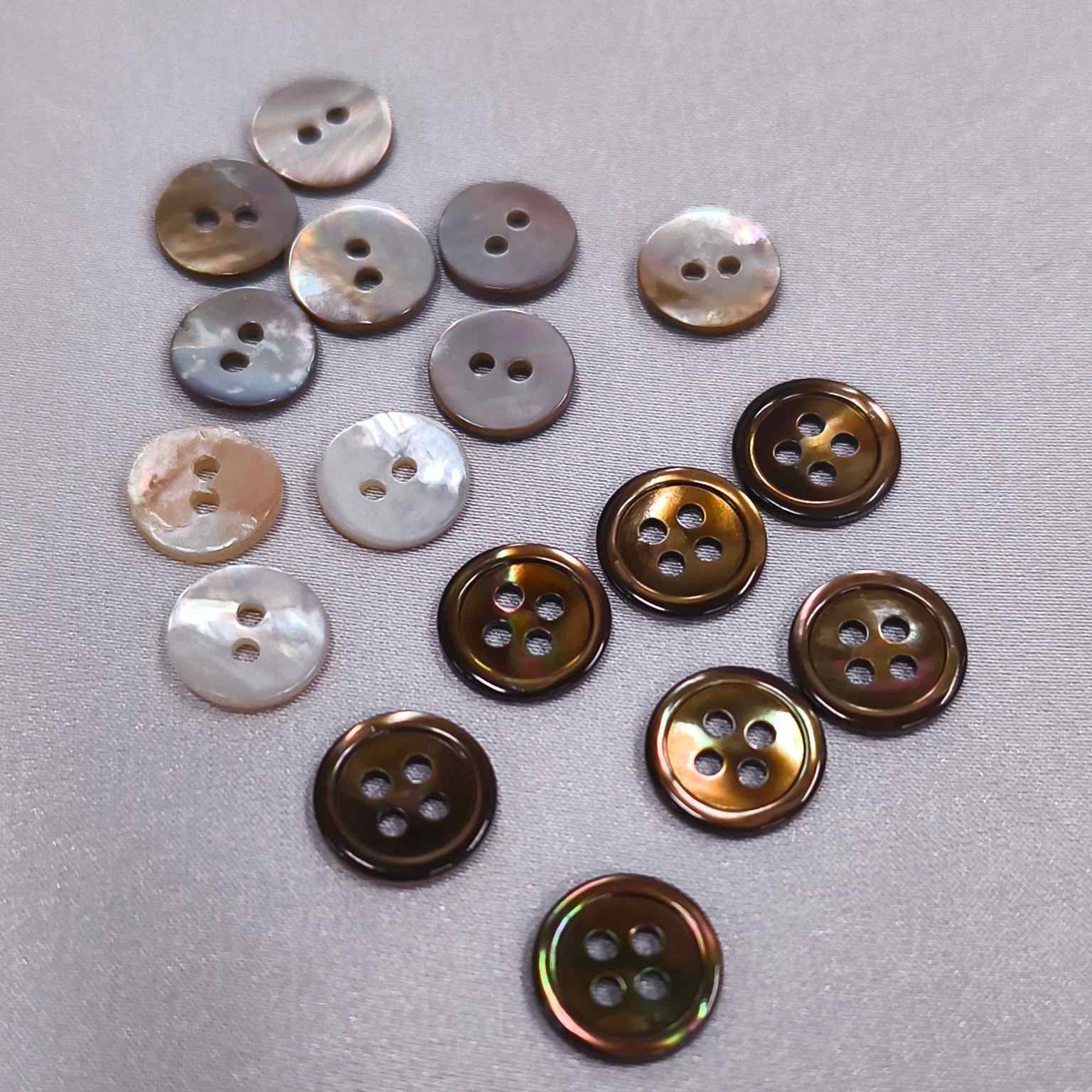 Collection of real shell buttons for custom silk dress production