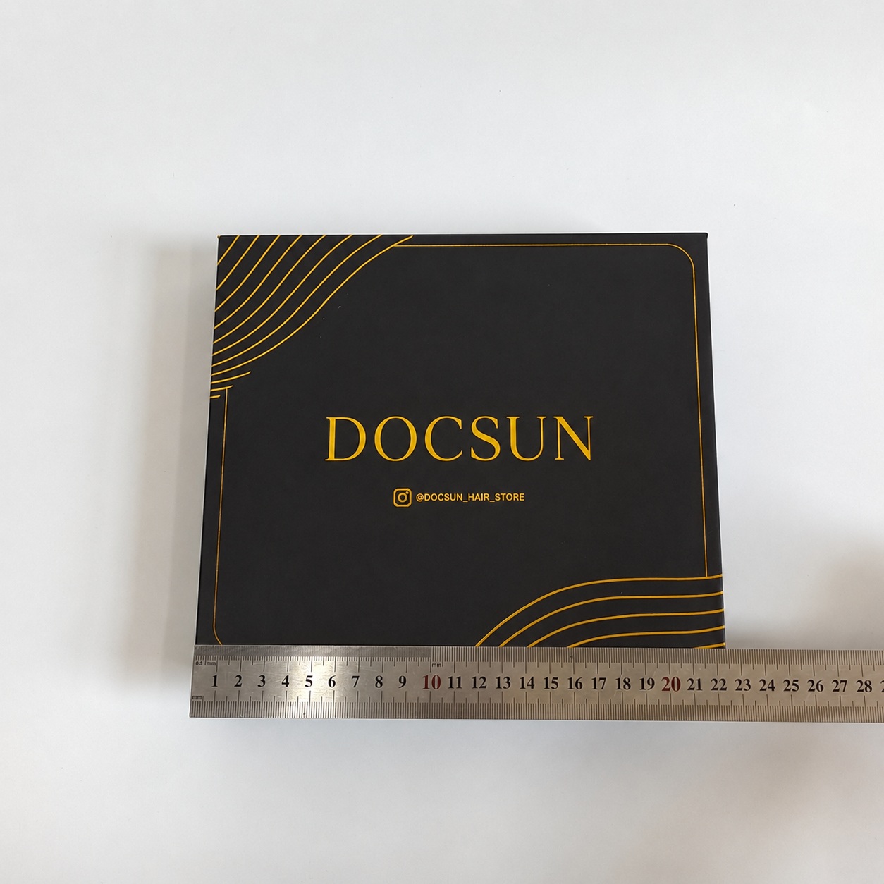Custom black packaging text and branding detail for silk product box