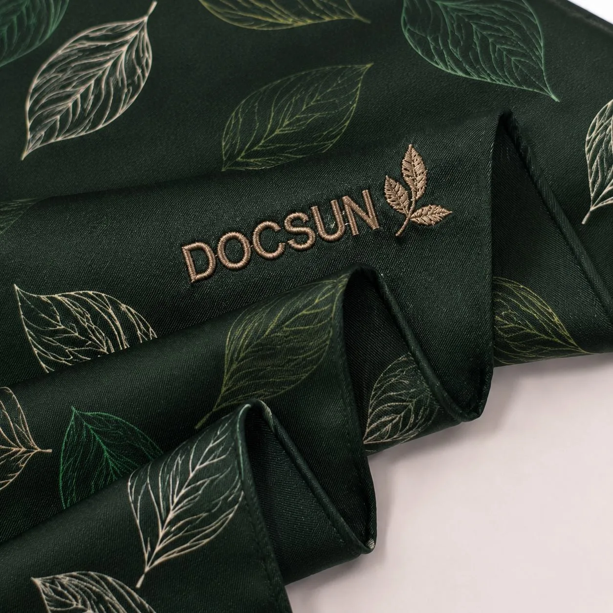 Custom embroidered logo applied to a branded scarf
