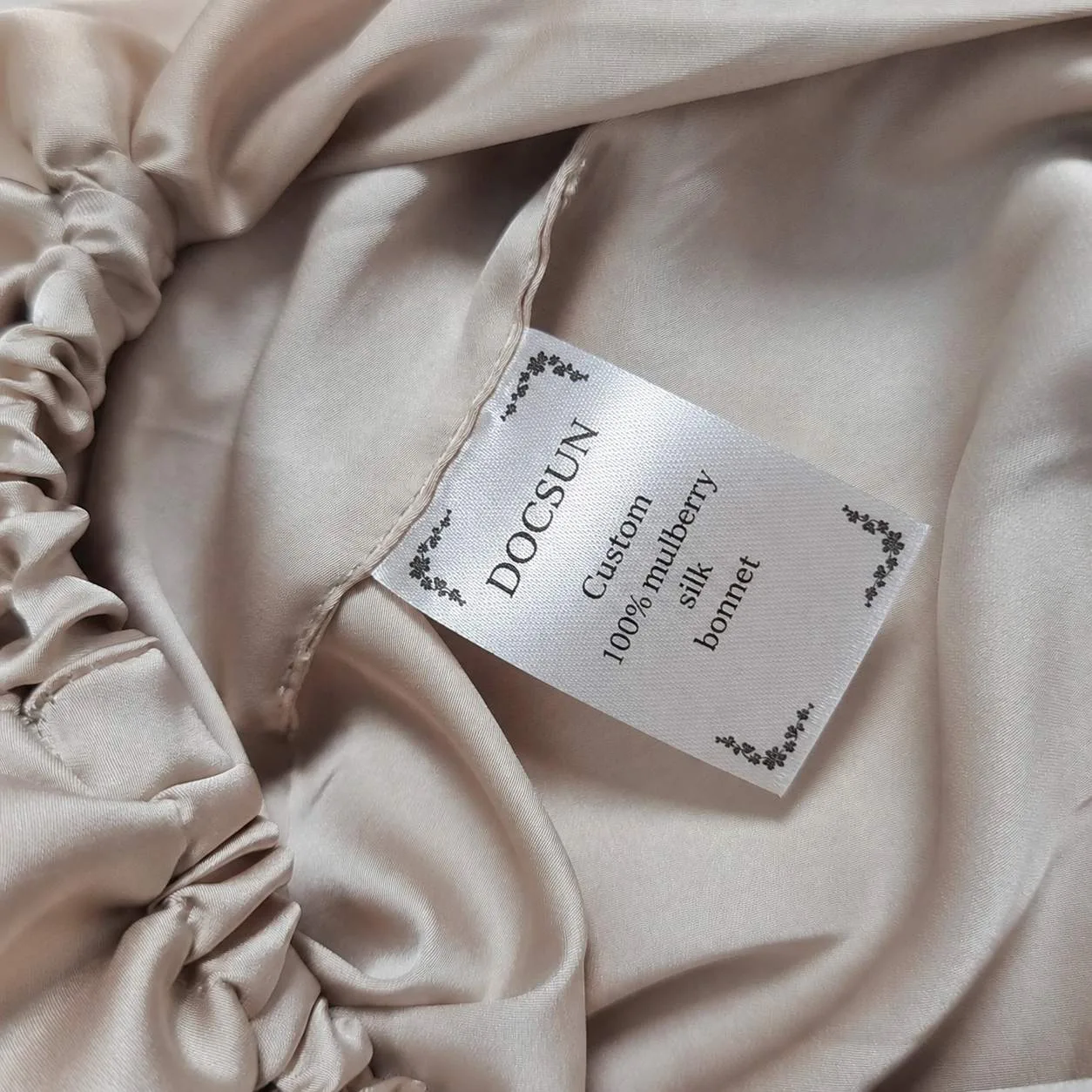 Custom brand and washing label inside a silk sleep bonnet