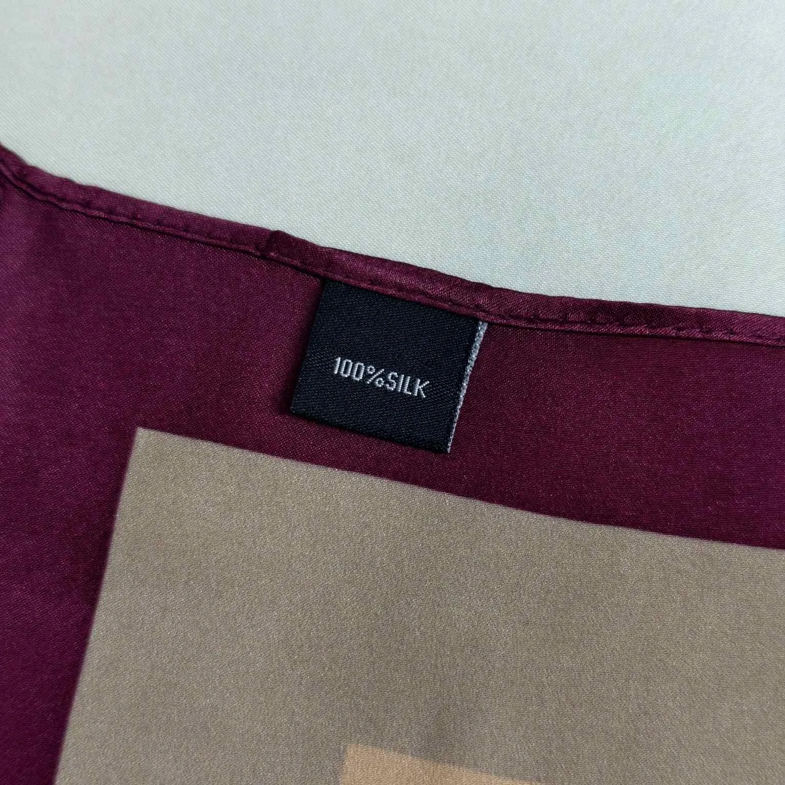 Custom woven labels for private label silk scarf production