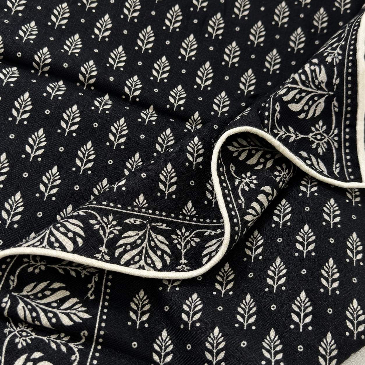 Leaf silk scarf detail showing luxury print and fabric