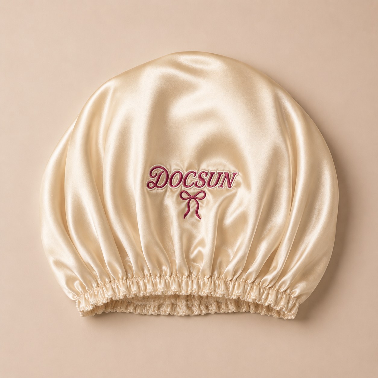 Custom embroidered logo on a private label silk bonnet