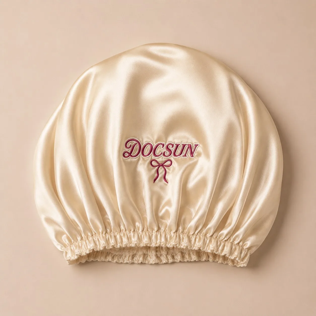 Custom embroidered logo on a private label silk bonnet