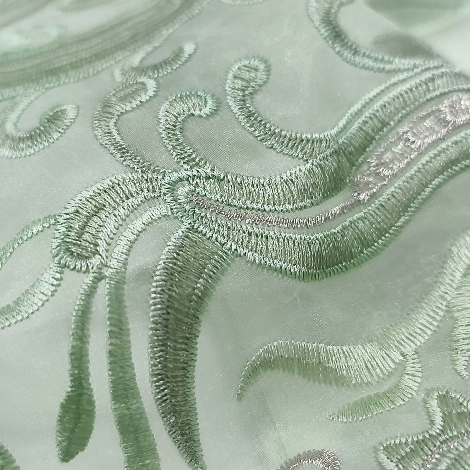 Fine embroidery craftsmanship applied to scarf fabric