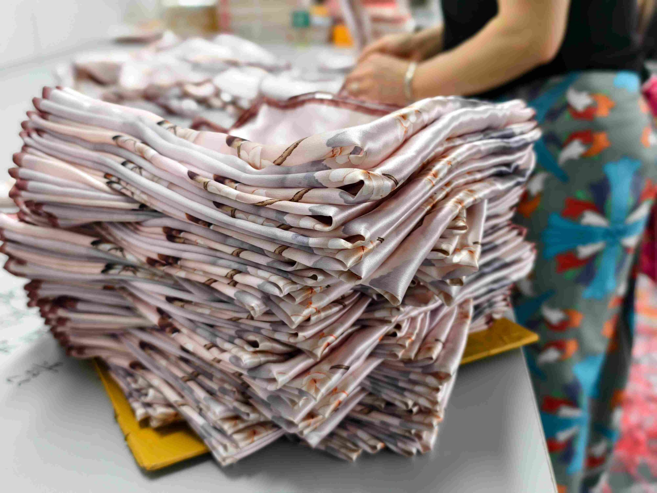 Finished custom printed silk scarf displayed after production and quality finishing