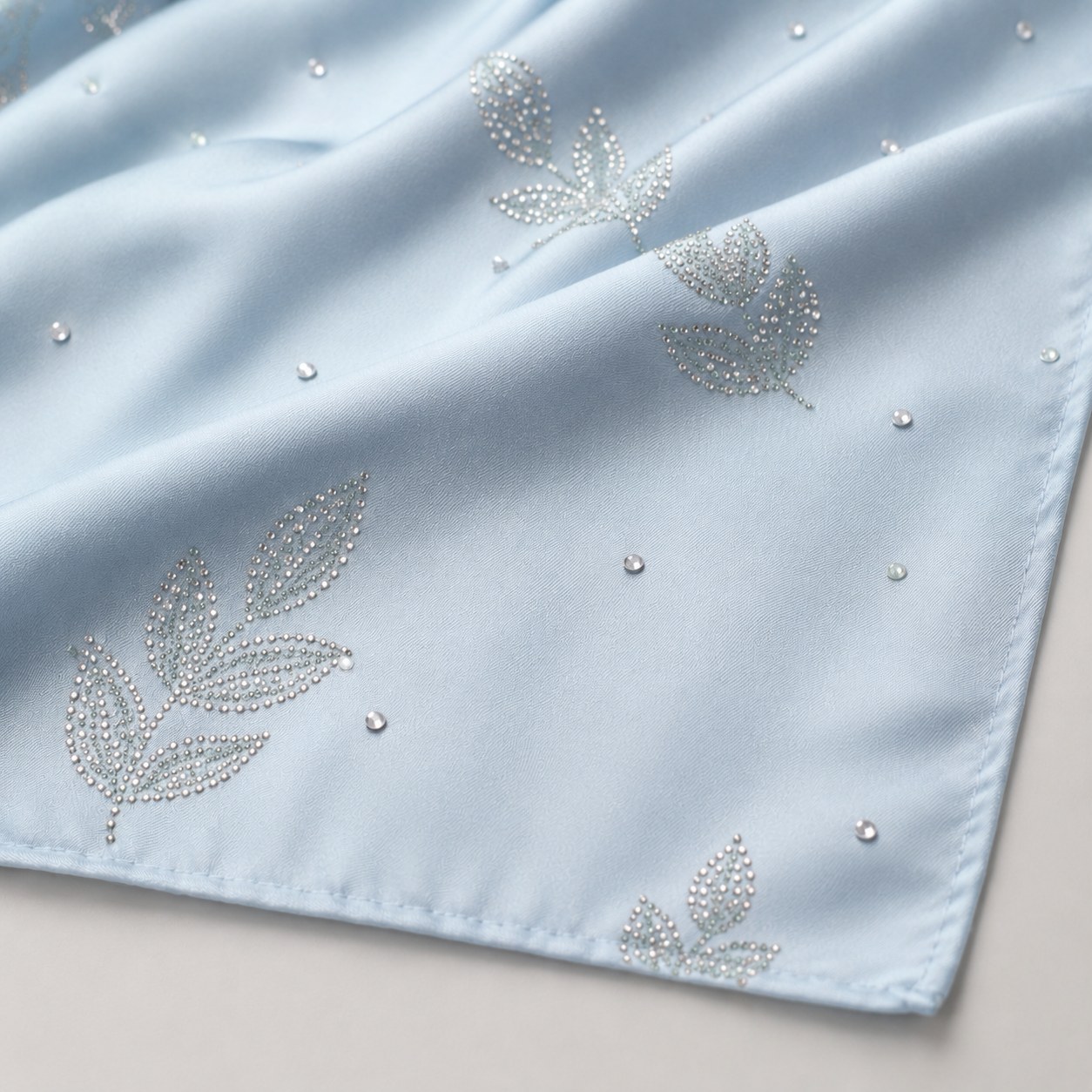 Hot-fix rhinestone embellishment applied to scarf fabric