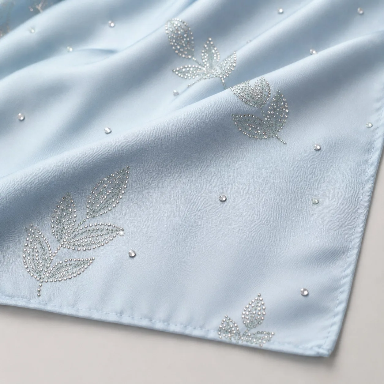 Hot-fix rhinestone embellishment applied to scarf fabric
