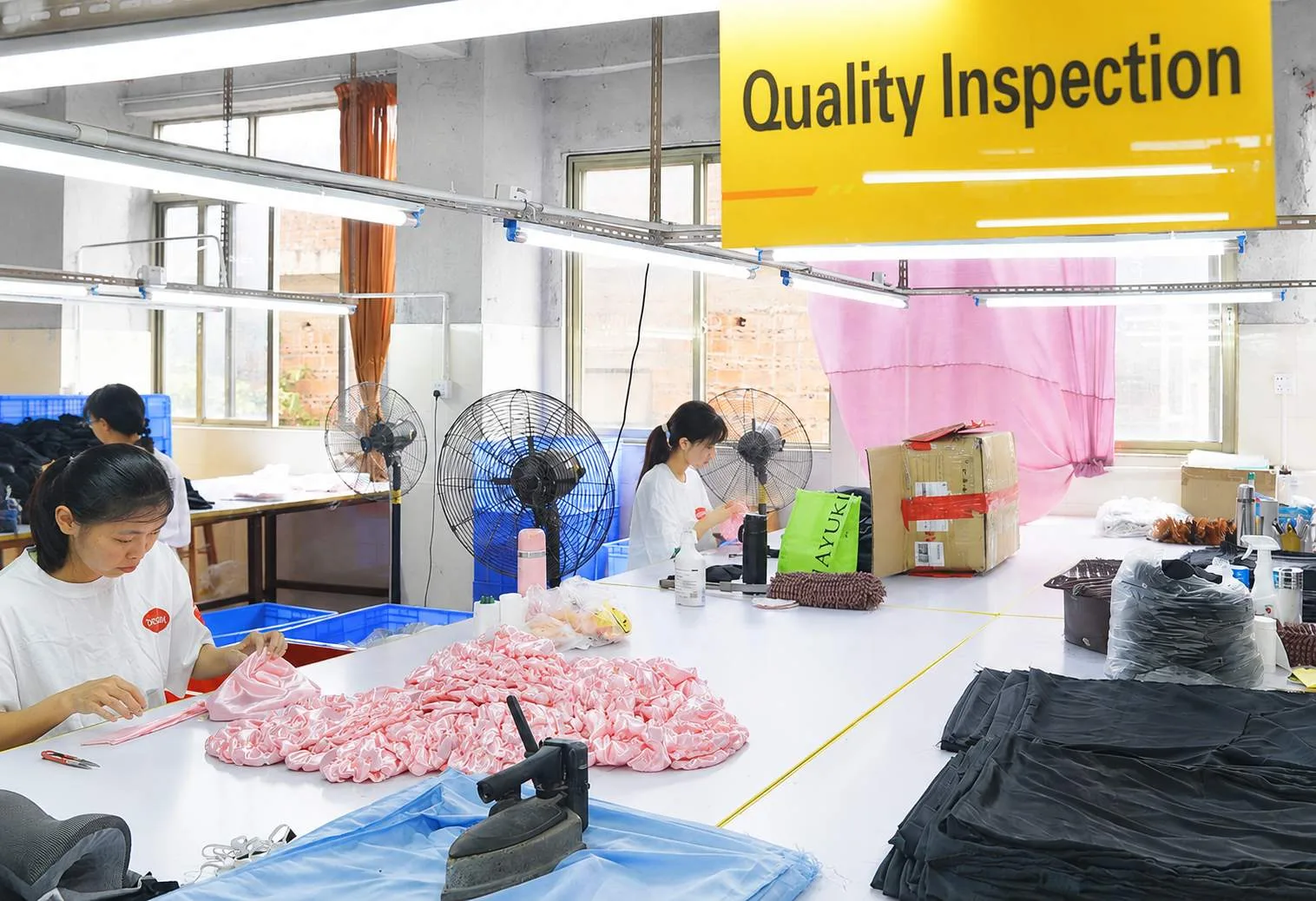 Quality inspection of custom silk sleep bonnets before packing