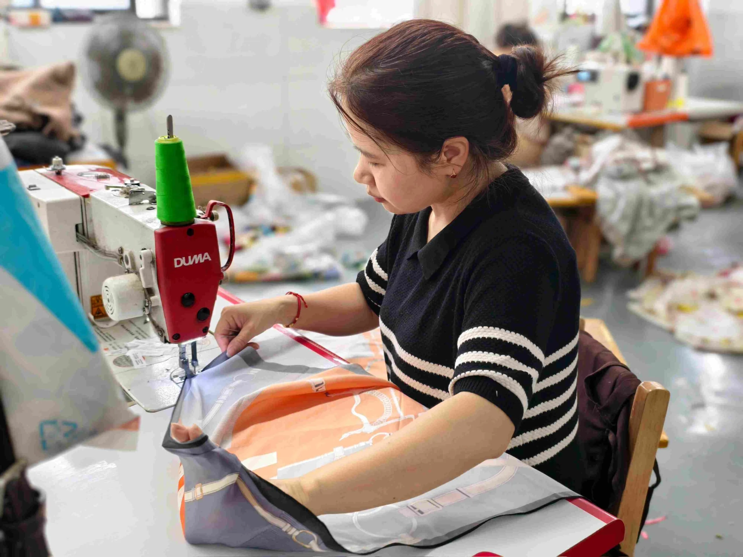 Professional sewing and edge finishing for custom silk scarves