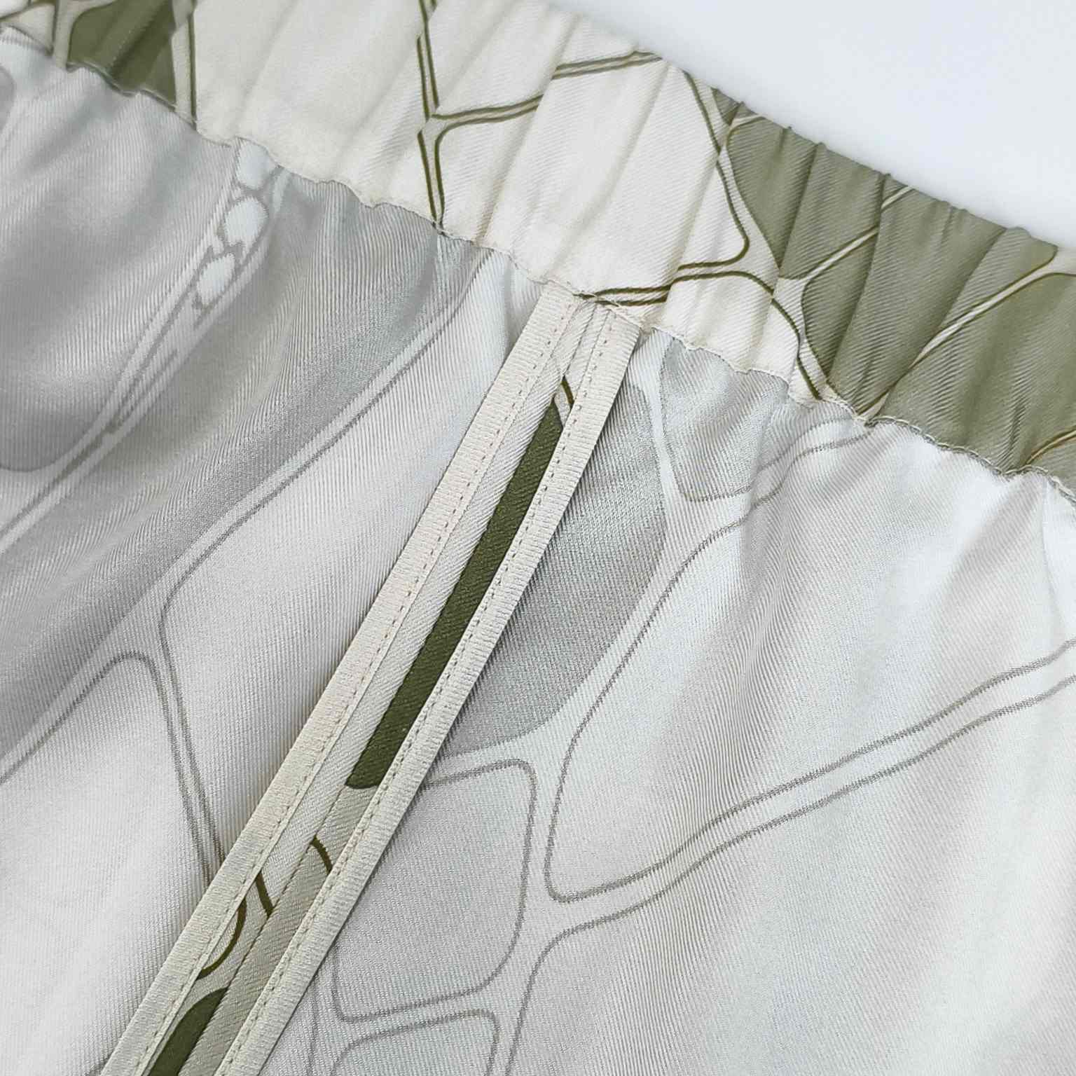 Detailed silk garment sewing technique for clean seams
