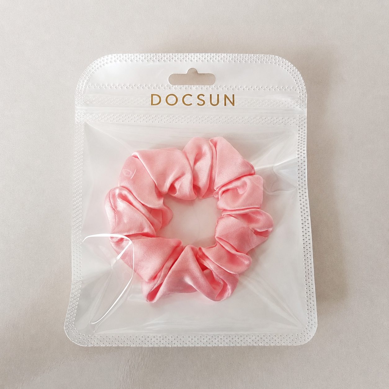 Single mulberry silk scrunchie prepared for individual private label retail packaging