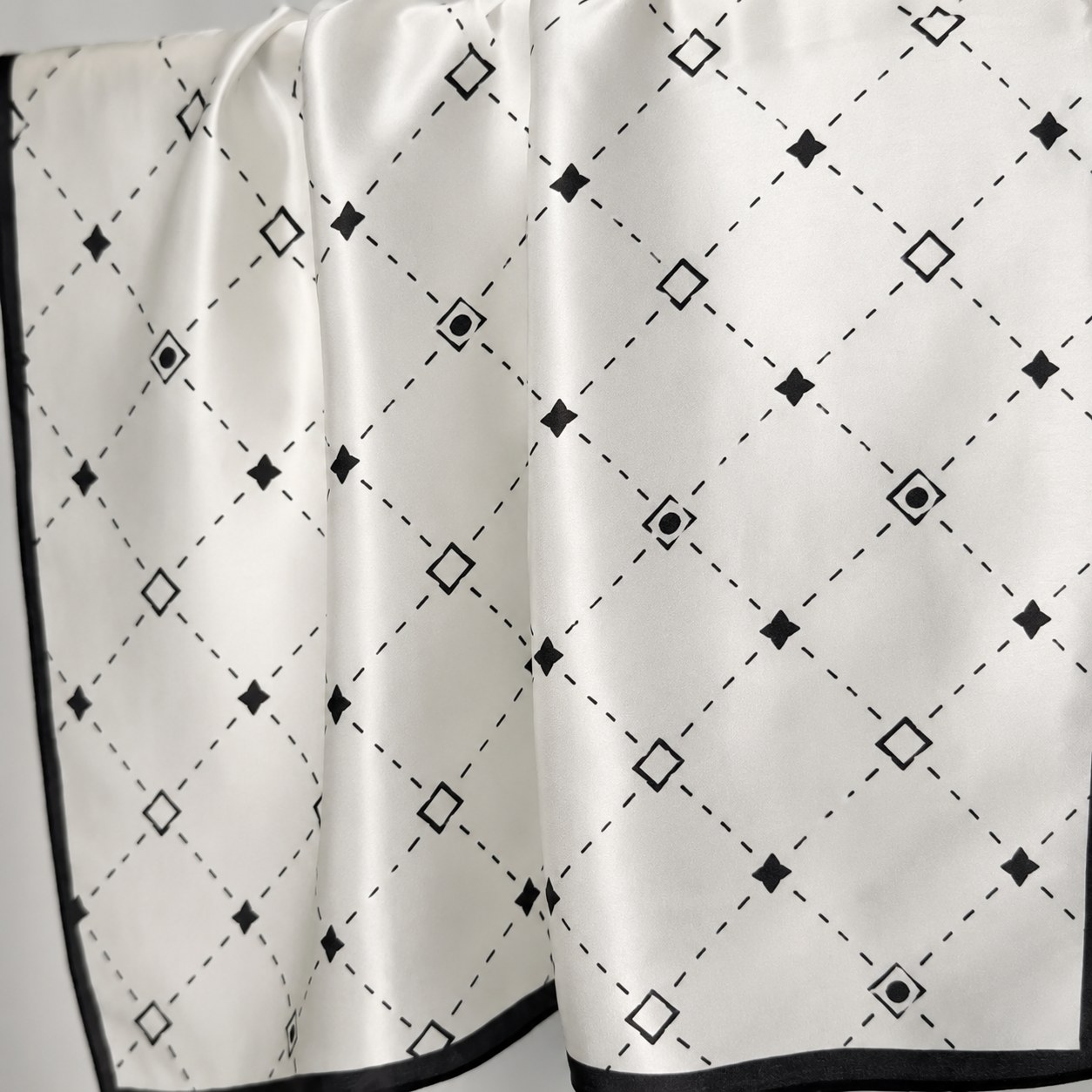 Soft natural silk sheen scarf showing premium fabric finish for sustainable custom silk accessories