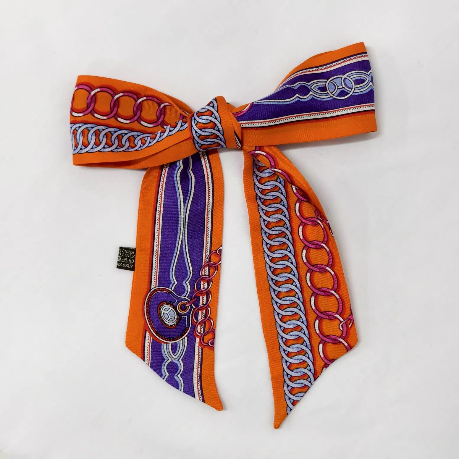 Orange silk scarf styling for warm color fashion collections