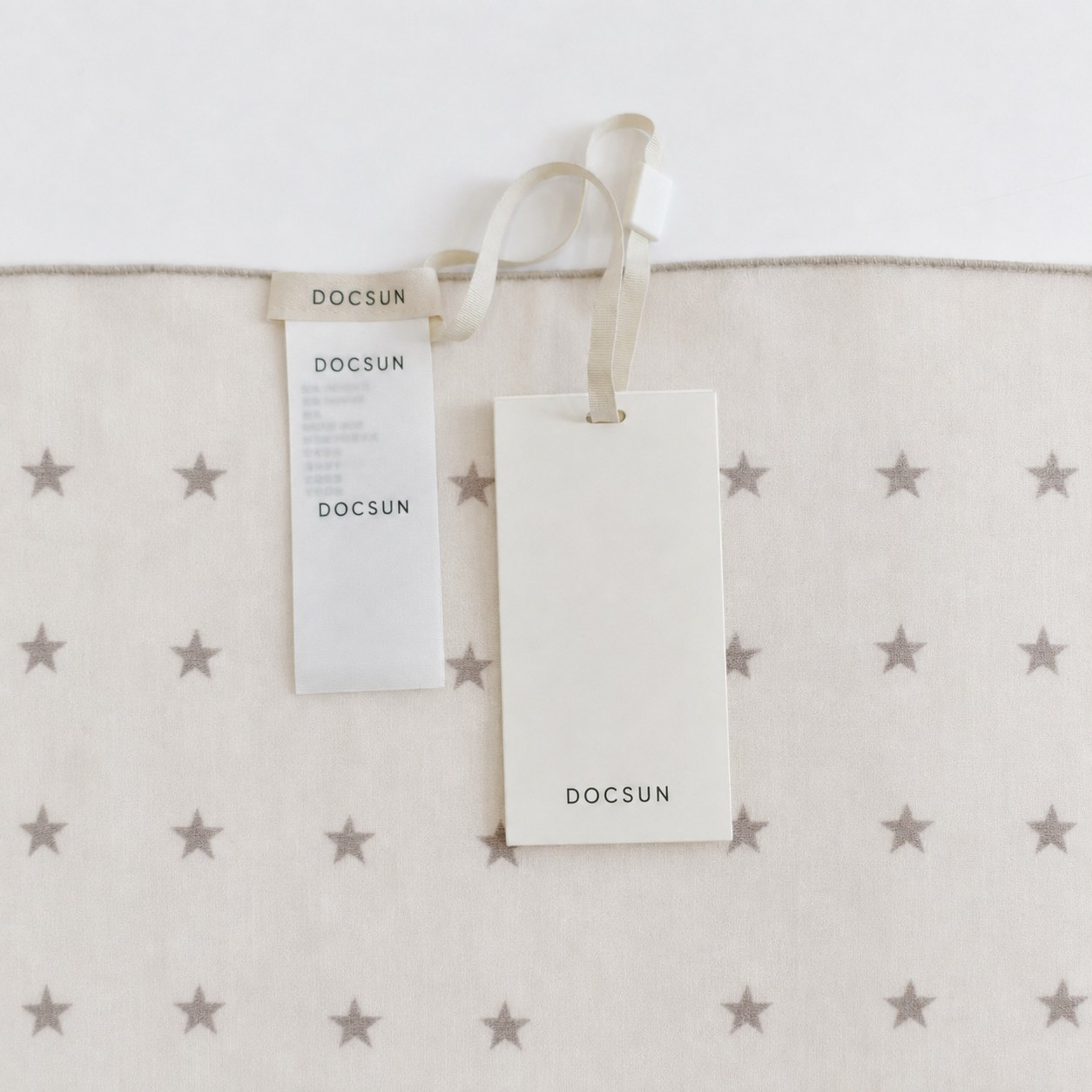 Custom woven label and hangtag for a private label cotton scarf